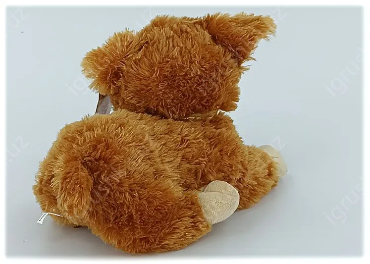 картинка Мягкая игрушка Щенок 15 см, лежачая собачка с золотым бантом от магазина igrushka.uz